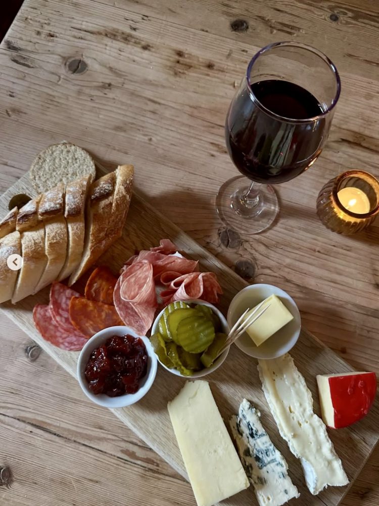 A glass of wine and grazing board at Pickles in Edinburgh