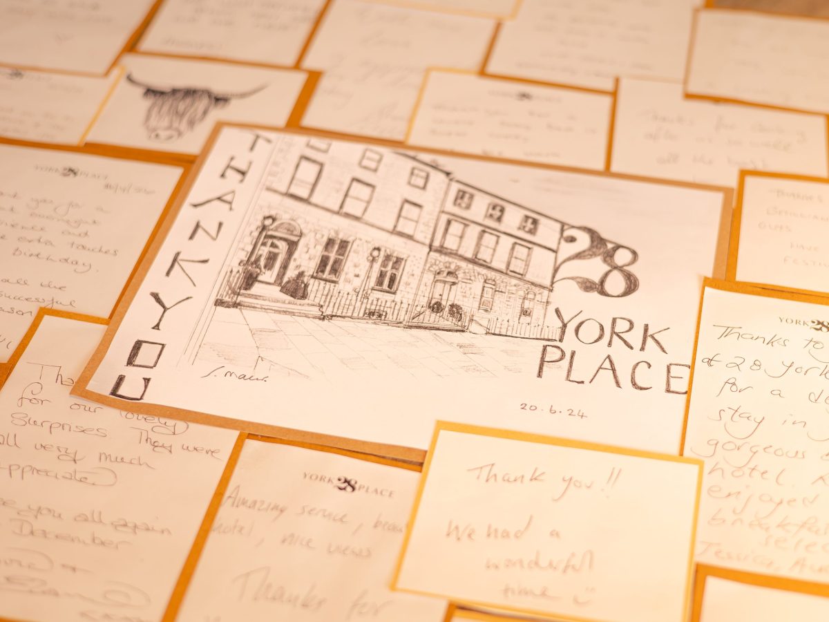 Handwritten guest thank-you cards and a sketch of the 28 York Place building.